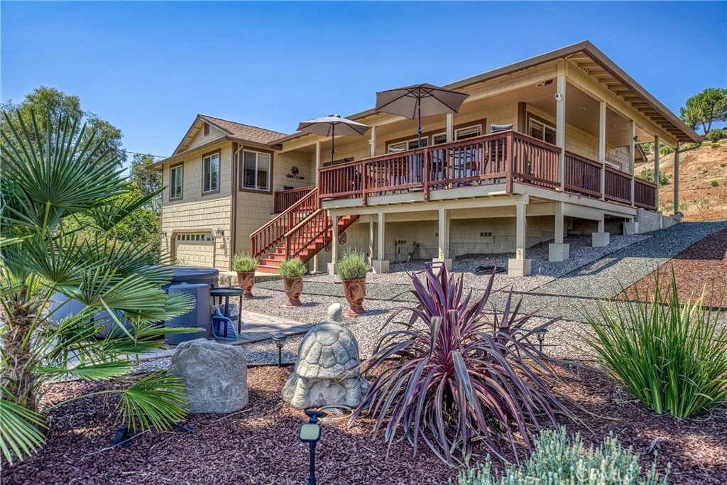 Gorgeous custom home with stunning lake views, ideally located in a quiet court. This single-level home offers 2168 sq ft of living space, complemented by a spacious 950 sq ft oversized garage. The property features low-maintenance landscaping and wrap-around decks, creating beautiful outdoor living areas with picturesque views of the surrounding wine country, lake, and mountains. Inside, you'll be greeted by a formal entry with coffered ceilings and modern lighting. This leads into an open, light-filled great room with vaulted ceilings, ceiling fans, a three-sided fireplace, and artistic niches, all contributing to its elegant architectural design. The large kitchen boasts granite countertops, stainless steel appliances, a center island, and a peninsula, conveniently situated adjacent to the formal dining area. The dining area includes a built-in buffet cabinet and a slider door that opens onto the attached decks. All three bedrooms are located on this single level, along with an oversized laundry room that also provides office space. The primary bedroom (Bedroom #1) is a peaceful retreat with abundant windows, offering lovely views and fresh air. It features an en-suite spa-style bathroom with a walk-in custom-tiled shower, a soaking tub with vineyard views, toilet room and a walk-in closet. The second bedroom and 3rd Room offer closets and carpeting. A conveniently located hall bathroom serves these rooms, featuring double sinks with granite countertops and a tub/shower combination. Outside, the property includes low-maintenance landscaping and a concrete driveway. Located above Clearlake enjoy year-round water sports sunsets and sunrises. Kelseyville is located only 2 Hours from San Francisco and Sacramento.
