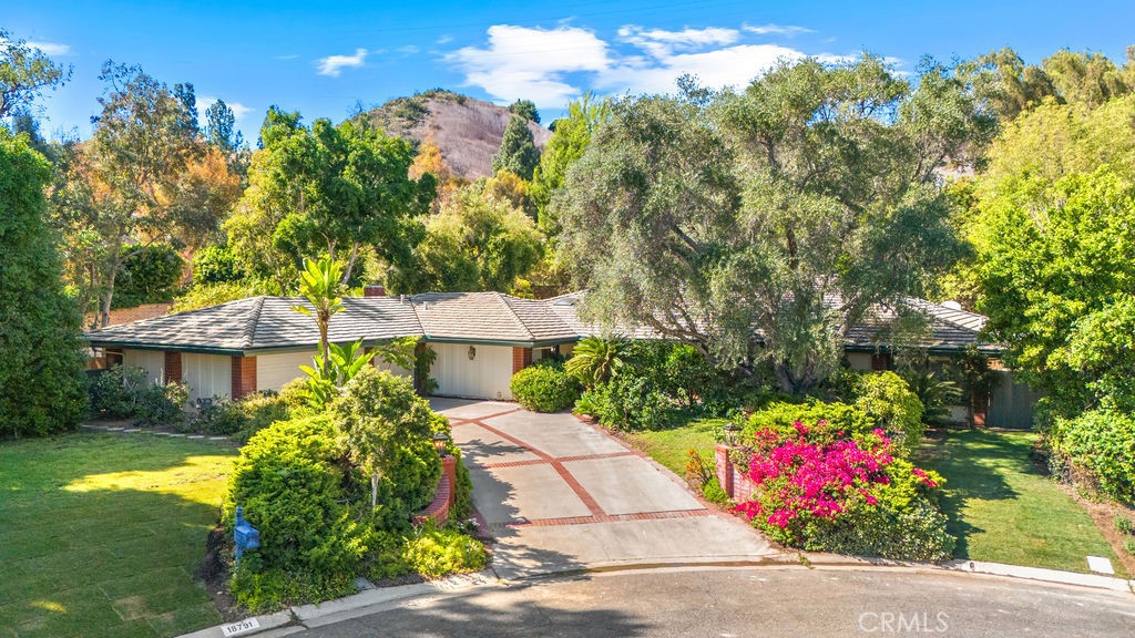 Welcome home to this beautifully upgraded single-level ranch-style home ideally situated at the end of a quiet cul-de-sac in "the hidden jewel", Villa Park. Entering the home through elegant double doors, you are greeted with a bright and open floor plan. Expansive windows frame picturesque views of the lushly landscaped grounds and bring in abundant light to each room. The gourmet kitchen is a chef’s delight, showcasing granite countertops, ample cabinetry, and a spacious walk-in pantry. The master suite is a private retreat, featuring a recently remodeled bathroom designed with luxury in mind. Highlights include a large walk-in shower, dual vanities, a separate make-up vanity, and a generously sized walk-in closet. Step outside into your very own private oasis. The resort-like backyard features a newly remodeled pool and spa, multiple areas to entertain and unwind, and a basketball court that can be reimagined as a pickleball court. The entire home has been recently painted, and new large-plank laminate wood flooring has been installed for the new occupants. This exceptional home combines comfort, elegance, and functionality in a serene setting. Conveniently located near fine dining, excellent schools, and shopping, this is the perfect place to call home.