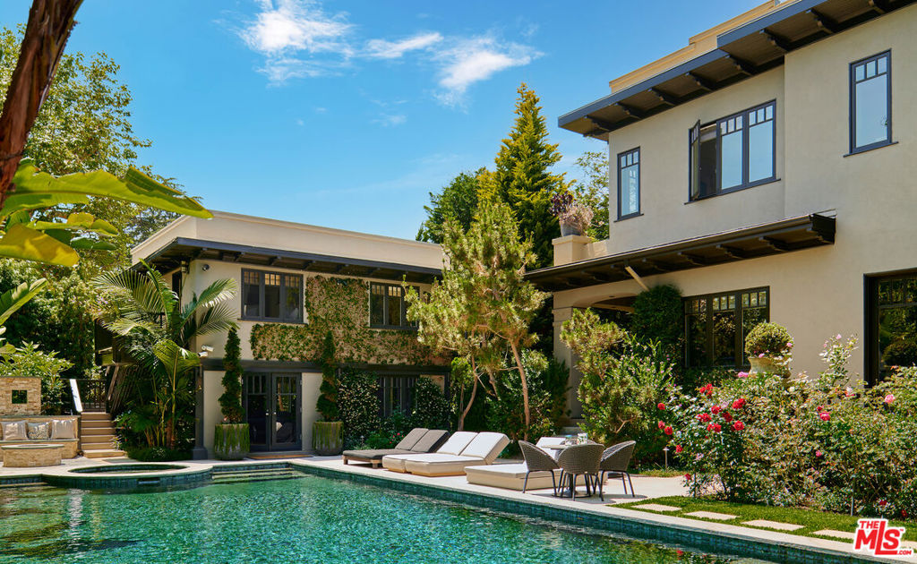 Discover the epitome of luxury living at 2020 Georgina, a rare double lot estate in prime Santa Monica. Meticulously restored and fully upgraded, this majestic residence boasts 4 bedrooms, 5.5 bathrooms, and a detached 2 bed/1.5 bath guest house. Soaring ceilings and French Oak floors set the stage as floor-to-ceiling windows envelop every corner of this home, bathing it in natural light. Tall gallery walls, expansive terraces, and strategically placed glass create a seamless integration, beautifully blurring the lines between indoor and outdoor spaces.The chef's kitchen with a marble island, Wolf and Sub-Zero appliances, and a dining area with French doors to the gardens serves as the heart of the home. The primary suite features dual bathrooms and walk-in closets, as well as three additional ensuite guest bedrooms and a study, complete upstairs. Impeccably maintained gardens, lush trails, a fire pit, al fresco dining areas, and a large pool and spa provide an oasis of relaxation. Additional features include a 2-story guesthouse with an office and sauna, as well as a three-car showroom style garage. Designed for both elegance and modern luxury, 2020 Georgina stands as a testament to meticulous craftsmanship on one of Santa Monica's most coveted streets.