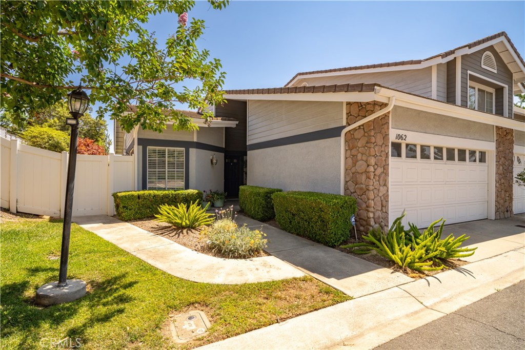 Welcome to this beautifully maintained single-story condo nestled in a highly desirable community. This end-unit home features a rare L-shaped backyard with mature trees, lush greenery, and custom hardscape — perfect for relaxing, entertaining, or creating your own garden oasis. Step inside to find freshly shampooed carpet, custom window blinds, and a remodeled kitchen with granite countertops and modern finishes. The oversized primary suite offers a spacious retreat with a walk-in closet and a dual-sink vanity in the en-suite bathroom, also finished with granite countertops.Additional highlights include a detached Two car garage, plenty of guest parking, and access to an award-winning school district. Conveniently located near top-rated schools, shopping centers, dining, and more — this move-in ready gem won’t last long.