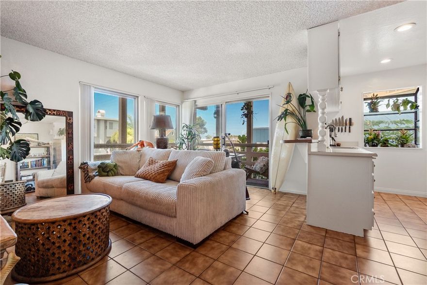 This Hermosa Beach Sand Section 1-bedroom, 1-bathroom corner unit with approx. 575 sq. ft. offers a cool and functional layout in a prime location. Just 2 blocks from the sand, moments to Hermosa Beach Pier, local shops, and across the street from the neighborhood favorite Granny’s Grocery. INTERIOR FEATURES: Open-concept living, dining, and kitchen areas with large windows; Kitchen with ample cabinet space and included appliances; Balcony with coastal breezes and peek-a-boo ocean views. BEDROOM & BATHROOM: Private, well-sized bedroom with generous closet space; En suite bathroom directly connected to the bedroom. BUILDING AMENITIES: Rooftop deck with panoramic ocean views from Malibu to Palos Verdes; Space for entertaining, relaxing, and year-round sunset views; Coin-operated Laundry. PARKING & STORAGE: Dedicated 1 car garage space with storage; Option to have an enclosed 1-car garage for an additional $350/month. HIGHLIGHTS: Corner unit; Combination of ocean views and a practical floor plan; Central Hermosa Beach location.