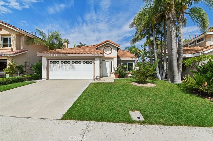Wonderful single-level detached residence nestled within the idyllic Rancho Niguel neighborhood of Laguna Niguel. Located on a single-loaded street with panoramic views of the Saddleback range, this home is a must-see. The main level offers a spacious and inviting layout. The open kitchen showcases updated shaker cabinetry, quartz countertops, a garden window, and stainless steel appliances. The family/dining room features vaulted ceilings, a cozy fireplace, and large sliding doors that seamlessly connect the indoor and outdoor living spaces—perfect for embracing the coveted California lifestyle. At the front of the home, you’ll find another large living/dining room, also with vaulted ceilings. Retreat to the generous owner’s suite with a walk-in closet and sliding doors to the exterior patio. Two secondary bedrooms, a second bathroom, and an interior laundry room complete the floor plan. Parking is ample with a two-car garage and driveway. The tranquil backyard serves as a private oasis—ideal for garden enthusiasts or anyone looking to relax on warm summer days. Additional upgrades include a high-end security system, double-pane windows and sliding doors, wood-look tile flooring, fresh paint, updated fireplace, attic flooring with new R-38 insulation for storage, re-piped and a newer HVAC system. This incredible home is conveniently located near schools, shopping, dining, trails, and transportation. Residents also enjoy membership to The Club at Rancho Niguel, offering access to pools, a spa, gym, tennis and pickleball courts, basketball courts, and sand volleyball courts.