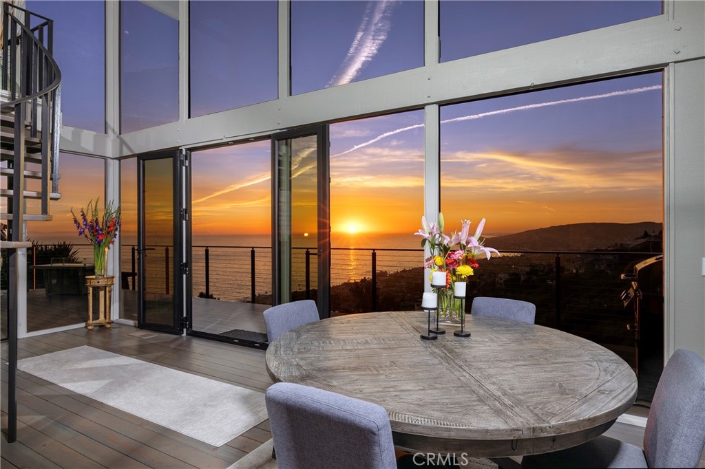 Miles of glittering coastline and an uncompromised panorama of the Pacific unfold before this one-of-a-kind respite. Originally designed by J. Lamont Langworthy, the residence is an exceptional representation of his notable and resilient designs, beautifully balancing function with the natural surround. The remarkable four-bedroom (one currently fashioned as an office), three bath home, with its unique orientation and layout, offers an enhanced feeling of privacy, while a two-level ‘wall’ of glass and a ‘two-story’ open environment affords breathtaking views from nearly every living area. The property was recently refined to complement the home’s efficiency and distinctive architectural detail, including the addition of Lutron automation; installation of Fleetwood windows; new skylights, heating, piping, Azek decking and Viewrail system, roof and rain gutters; along with kitchen and bath renovations incorporating fine finishes and materials with designer fixtures and appliances. Further distinguishing this extraordinary offering – three ocean view terraces to entertain and enjoy the sights and sounds of this picturesque, sought-after location, as well as optimal proximity to regional amenities and the treasured lifestyle of Laguna Beach. The adjacent lot of approximately 3,485 square feet is included in the offering.