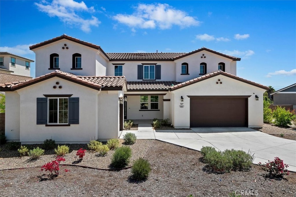 Welcome to this nearly new luxury residence nestled in one of Riverside’s most exclusive neighborhoods—where refined living meets the tranquility of nature. Spanning nearly 3,700 square feet and set on over an acre of land, this exquisite home offers exceptional privacy with no neighbors behind or to the right. Instead, you’ll enjoy unobstructed views of open natural space and the peaceful ambiance of a seasonal creek, where the gentle sound of frogs adds to the serenity.
Designed for both elegance and comfort, this five-bedroom, four-and-a-half-bath home features a thoughtfully designed floor plan that includes a downstairs guest suite with its own private en-suite bath—ideal for multi-generational living or visiting guests. Upstairs, a generous loft area offers the perfect flex space for a home theater, children's playroom, or homeschooling setup.
The heart of the home is the stunning kitchen, boasting upgraded stainless steel appliances, crisp white quartz countertops with subtle grey veining, a designer tile backsplash, and soft-close light grey cabinetry—including extra-deep drawers and a walk-in pantry for ultimate convenience. The adjoining dining and living areas flow seamlessly for easy entertaining.
Retreat to the expansive primary suite with a spa-like en-suite bath, dual vanities, and a spacious walk-in closet. Step outside to the large covered patio, perfect for al fresco dining or relaxing while enjoying the beautifully landscaped yard and peaceful surroundings.
This eco-conscious home is loaded with high-end features including owned solar panels, a tankless water heater, whole-house water filtration system, epoxy-coated garage floors, and EV charging for both Tesla and other electric vehicles. Drought-tolerant landscaping and a front yard maintained by the HOA provide beauty with low maintenance, giving you more time to enjoy the scenic neighborhood trails and evening sidewalk strolls.
Experience the rare blend of privacy, nature, and modern luxury—right in the heart of the city. This is more than a home; it’s a lifestyle.