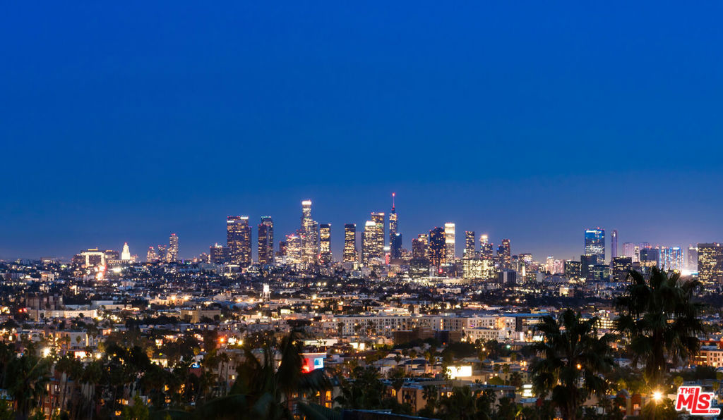 Behind a Private gated entry, resides one of the last approx. 1-acre promontories, completely secure and without a neighbor in sight, hovering just above the legendary Chateau Marmont. The property sits on its own island carved into the Hillside with the most explosive views the city has to offer spanning from the Griffith observatory to the Santa Monica Beaches. Not only is there the coolest Hollywood Regency home on the property, but there are also Permit Ready plans for a 14,000 square feet masterpiece by Studio Tim Campbell (who designed the recently sold $58m home on Rising Glen and under the guidance of Jason Somers of Crest Real Estate). Once complete, "The Hillside Chateau," will be set behind a long, private gated drive with an oversized motor court. Flawlessly thought out with the most exquisite finishes and floorplan, the interior blends classic design elements with modern touches to create a truly remarkable space. High ceilings, cased openings, archways, and long dramatic hallways flow throughout the home. Seamless indoor/outdoor living with a mega view from all 7 bedrooms. The latest and greatest amenities include a theater with bar and lounge, gym with spa, wine cellar, and a gorgeous auto gallery to highlight your collection. Properties like this don't exist anymore. Here is your chance to own a $50+million property on the Sunset Strip. In addition, if there is a desire for a more contemporary design, the permit ready plans can be modified easily with the city.