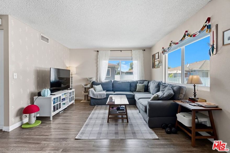 Welcome to 28016 Robin Ave, A Perfect Start for Buyers and Investors. This bright and inviting 2-bedroom, 1-bath upper-level condo is the perfect opportunity for anyone looking to own in the heart of Santa Clarita. Whether you are buying your first home or adding a solid property to your investment portfolio, this move-in-ready home checks all the boxes. Step inside to a spacious open-concept living and dining area filled with natural light from large windows. The updated flooring and neutral tones make it easy to personalize and create your own style. The galley-style kitchen offers plenty of cabinet space, a classic layout, and a window that frames a peaceful community view, the perfect spot for your morning coffee. Both bedrooms are generously sized, featuring ample closet space and ceiling fans for comfort. The private balcony-style patio offers an outdoor retreat, ideal for relaxing, entertaining, or creating a cozy garden nook. This well-maintained community is known for its lush green spaces, sparkling pool, and low HOA fees. You will love the easy access to shopping, dining, parks, award-winning schools, and major freeways, making commuting a breeze. For first-time investors, this condo is a smart choice. With strong rental demand in Santa Clarita, this home offers a great balance of affordability, location, and long-term value.