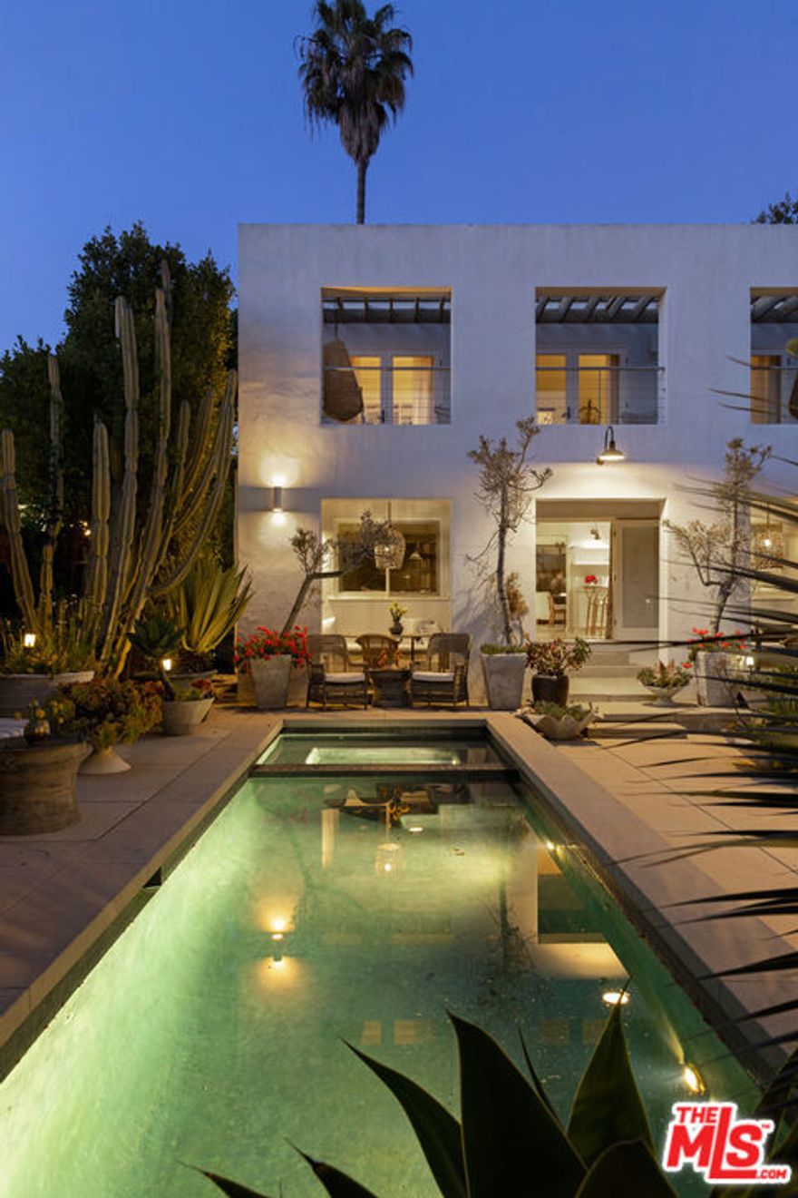 An architecturally and playfully designed compound at 906 Princeton Street nestled in one of Santa Monica's most coveted neighborhoods. Reimagined by renowned interior designer Kathryn Ireland, this residence has graced the pages of Elle Decor and other prestigious design publications. Spanning approximately 4,000 square feet on an expansive lot of over 8,000 square feet, this property boasts a 2-bed, 2.5-bath main house, a 1-bed, 1.5-bath guesthouse, and 1-bath gym/studio. The main house was enlarged by Mexican architect Ruben Ojeda. A stunning garden design by Steven Block of Inner Gardens. The home features high ceilings adorned with skylights and windows, bathing the interiors in natural light. The gourmet kitchen boasts top-of-the-line appliances, while the living spaces exude warmth and elegance. The primary suite encompasses a spacious bedroom, office area, dressing room, and a private outdoor patio. Outside beyond the main house, the two-story guest house was designed by Koning Eizenberg. The guest house includes a full kitchen and dining area on the first floor that opens to the courtyard and upstairs is the bedroom flooded with natural light and a balcony. The enchanting courtyard is centered around a sparkling pool surrounded by lush landscaping and ample space for lounging, entertaining, a fire pit and more. Located a stone's throw to all the shops and restaurants of Montana Avenue, the beach, Erewhon, Country Mart, and all the best of Westside living.