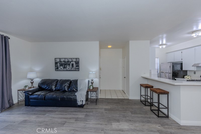 This is a lovely single-story condominium located in the beautiful Lakeside community. This home features a completely fresh coat of paint and an upgraded kitchen with granite countertops, a stainless steel refrigerator, stove, and dishwasher. The large living room offers an open-concept living space with large sliding doors that lead to the patio. A newer washer and dryer are conveniently located in a closet on the patio. The bedroom also has a large sliding door that opens to the patio with a view of the water features that run throughout the community. There is a walk-in closet and a large vanity area. The bathroom has a bathtub and shower which is separated from the vanity. The Homeowners Association (HOA) covers maintenance of the security gate, grounds, and trash services. Residents have access to a pool and jacuzzi, as well as a grassy area perfect for relaxing. This property is pet-friendly and and includes one assigned parking space. The property has been professionally cleaned, allowing for an immediate move-in. It is a super cute single-story home.