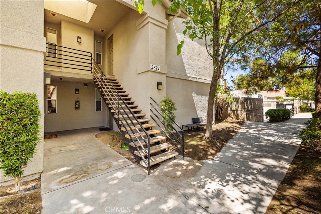 Discover the charm of this 2 bedroom, 2 bathroom upstairs condo offering comfort, privacy, and plenty of natural light. Enjoy a spacious balcony ideal for morning coffee or evening relaxation, and an open layout with a kitchen cut out design that connects seamlessly to the family room. The seller recently invested $16,000 to update the main bathroom, now featuring a walk-in shower. You'll also appreciate the in unit washer/dryer combo and a nearby 2 car garage. Set within a beautifully maintained community, you'll have access to mature shade trees, peaceful walkways, and a variety of amenities including a pool & spa, clubhouse, fitness center, tennis court, and playground that is a short walking distance from the unit. With shopping, dining, and Antelope Valley College just minutes away, this condo offers both convenience and a welcoming place to call home. Schedule a showing today and see all it has to offer!
