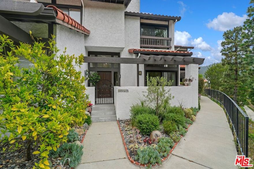 Discover the perfect blend of privacy, serenity, and stylish living in this beautifully updated Michael Lane townhome, nestled in the coveted Palisades Highlands. With sweeping canyon views and an abundance of natural light, this split level two-story residence offers a peaceful retreat from city life. Inside you'll find a light-filled interior featuring high vaulted ceilings, two spacious bedrooms, a formal dining area, and a charming breakfast nook just off the gourmet chef's kitchen thoughtfully designed with premium finishes. Recent upgrades include an elegantly remodeled primary bathroom, a stylish powder room, and a direct-entry  two car garage complete with washer/dryer and an additional refrigerator for added convenience. The two bedrooms have ensuite bathrooms and the primary bedroom has a large walk-in closet. Decorative carpet stair runners add warmth and charm at every level, while downstairs, the open layout flows effortlessly into inviting living spaces perfect for both everyday comfort and entertaining. Enjoy resort-style amenities including a sparkling community pool, rejuvenating sauna, and fully-equipped gym, a short distance from the front door. For nature lovers, scenic hiking trails and outdoor adventures await just moments away, offering the ideal setting for a healthy, active lifestyle. Unfurnished unit, no pets. Although the Palisades fires in early 2025 did not impact this home directly, all "walls-in" components  and ductwork and attic spaces  have been professionally remediated by ServePro for added peace of mind. In addition, for three months top-of-the-line BluAir HEPA filters have been operating throughout the  townhouse to ensure cleaner fresher air in the residence.