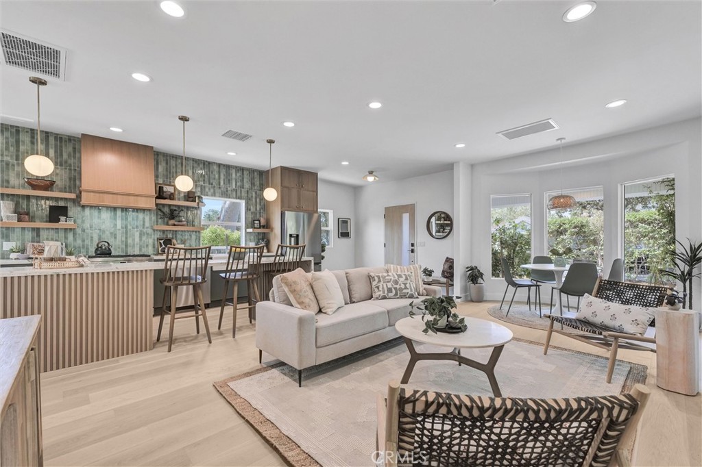 Located in the highly sought-after Madison Heights neighborhood, this beautifully remodeled 1,431 sq. ft. home offers an open floor plan that blends sophisticated elegance with modern convenience. With meticulous attention to detail, the residence features 3 cozy bedrooms and 3 bathrooms, each showcasing contemporary finishes.
Upon entering, you’re welcomed by a spacious living room that flows effortlessly into the mid-century-inspired kitchen, which features with two-toned cabinetry, a large central island, and sleek quartz countertops. The open-concept design extends into the living and dining areas, providing a seamless space ideal for both entertaining and daily living. This home offers exceptional versatility with two master suites, while the third bedroom offers the potential to serve as a home office. Throughout the home, stunning engineered wood floors add sophistication and warmth to every room. Step outside into the backyard, where you'll find ample space for outdoor activities and an convenient side entrance to one of the ensuite. The detached 2-car garage with a bonus storage room in the back further enhances this home's functionality.
Centrally located just minutes from top restaurants, theaters, parks, and entertainment options, this home is in close proximity to renowned schools including Caltech, Polytechnic School, Westridge School, Sequoyah School, and more. Don’t miss the opportunity to own this exquisite home in one of Pasadena’s most desirable neighborhoods.