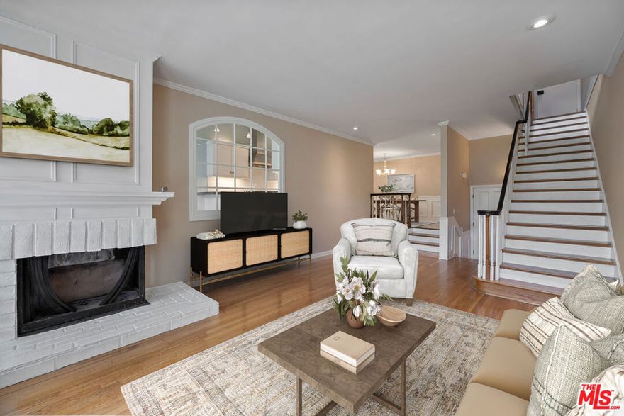 Welcome to your dream home at 17099 Palisades Circle! This open and airy 3-level end-unit townhouse spans 2,086 square feet of thoughtfully designed living space. You'll love the high vaulted ceilings in the kitchen as well as in the primary bedroom. There are beautiful views from every room, hardwood floors, and classic wood stairs and banisters. The wood-burning fireplaces in the living room and primary bedroom are perfect for creating a cozy ambiance. Outdoor areas include a patio and 2 balconies with an ocean view from the upstairs balcony. Enjoy the convenience of a large direct entry 2 car garage, lots of cabinet space, laundry room, and cedar closet. The complex offers exceptional amenities, including a gym, pool, sauna, and tennis court for an active lifestyle. This sweet little community in the Palisades Highlands is surrounded by Topanga State Park hiking trails. Don't miss the opportunity to make this stunning unit in a great area and complex yours!