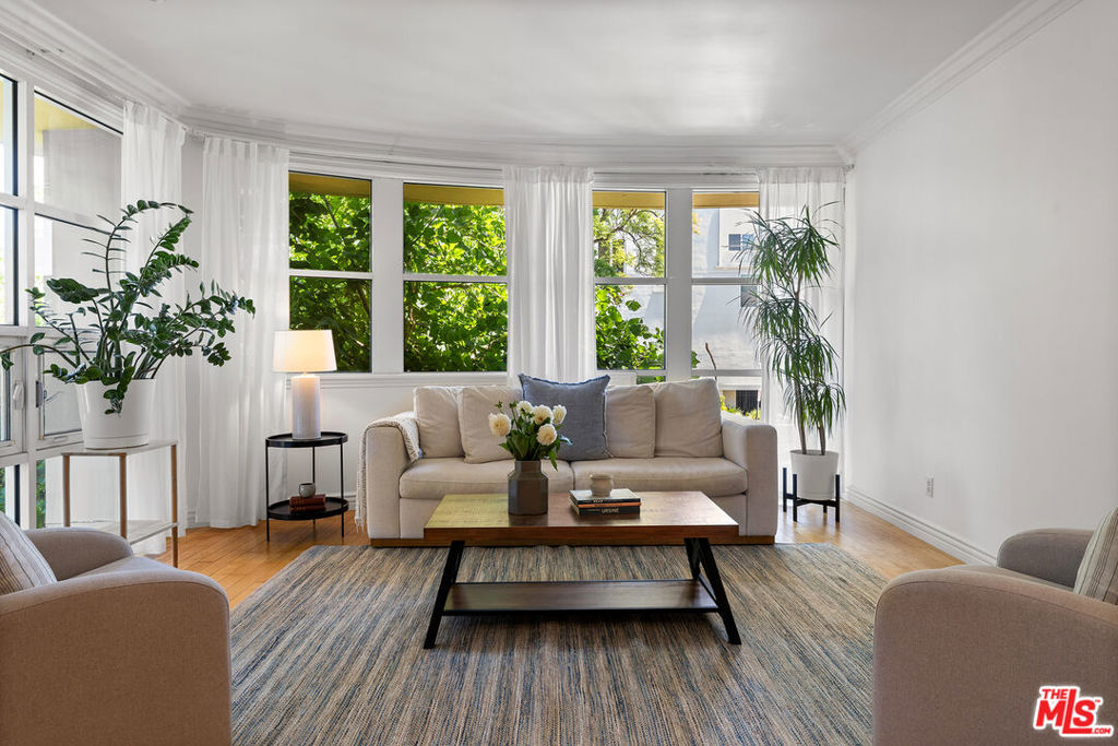 An unparalleled experience on the Westside: this expansive 4-bedroom, 4.5-bathroom residence features floor to ceiling windows, new appliances, and a luxurious master suite. Spanning the entire northern half of the second floor plus a private second level, the home checks all the boxes: scale, layout, privacy, and location. Designed for modern living and effortless entertaining with an open floor plan and upgraded features like a dual-sided fireplace, coffered ceilings, and a chef's kitchen with huge island. Thoughtfully updated with new windows, custom kitchen with upgraded appliances, new HVAC, custom closets, renovated spa like master bath, and more. The main level features an expansive living room bathed in natural light from the custom floor to ceiling windows - opening into a dining room and open concept kitchen. Two en-suite bedrooms, including a spacious primary suite with soaking tub and private balcony. Downstairs, you will find two additional ensuite bedrooms, a laundry area, and custom storage closet providing flexibility for guests, home office, or multigenerational living. Additional highlights include direct-access secured elevator with personalized controls (serving only two residences per floor) and two gated garage parking with guest spots. Set in one of LA's most desirable neighborhoods, minutes from UCLA, Westfield Century City, Santa Monica, Brentwood, Beverly Hills, Silicon Beach tech hubs, LAX, and a world-class selection of dining and shopping options - while walking distance. You won't find another property like this on the west side at this price point.