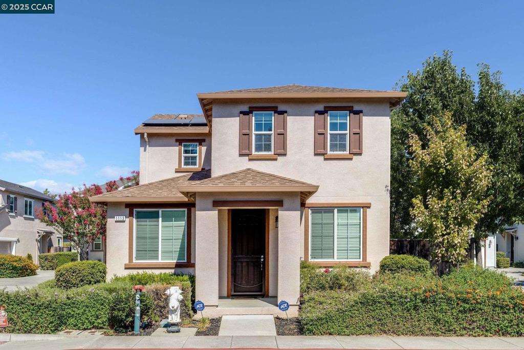 Move-in ready and waiting for you, this stunning 4-bedroom, 3-full-bath home offers modern luxury and comfort. The first floor features updated flooring throughout the living areas. The beautiful kitchen boasts a large granite island, granite countertops, an expansive backsplash, and plenty of cabinet space. It includes an upgraded gas range, microwave, and dishwasher. Adjacent to the family room, you can step out onto the patio, perfect for outdoor relaxation and entertaining. The first floor also has a convenient bedroom and full bath and access to the garage. Upstairs, you'll find an extra-large primary bedroom with an en-suite that includes double sinks and a spacious walk-in closet. Two additional bedrooms share a Jack & Jill bathroom. The upstairs laundry room adds extra convenience.This home also features a 2-car attached garage with ample storage, leased solar panels, and a community park. Don’t miss out on making this beautiful home yours today!