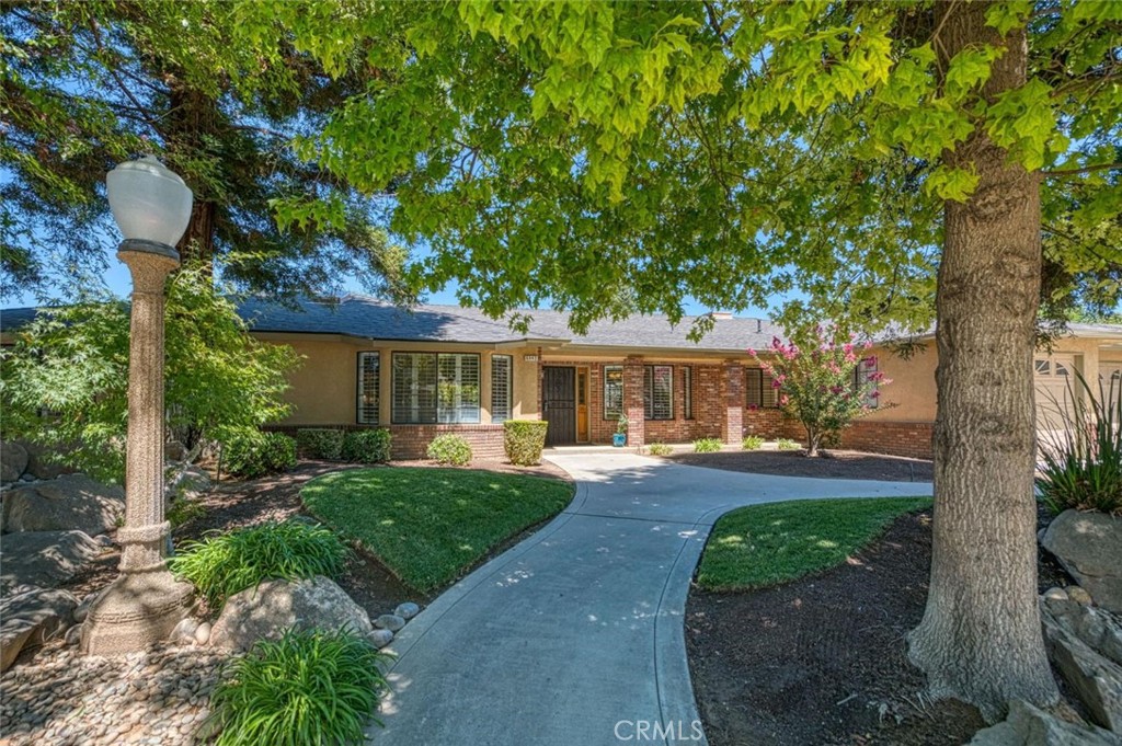 Welcome to a stunning residence in an established Northwest Fresno neighborhood just moments from shopping, dining, and convenient freeway access, this impeccably maintained home offers both comfort and style. Designed with care and functionality, the flexible floor plan includes four spacious bedrooms, three full bathrooms, and a versatile bonus suite perfect for guests, multi generational living, or a dedicated home office. As a former model home, it offers timeless features like plantation shutters and custom built-ins, including thoughtfully placed hampers in the laundry room and bathrooms. The kitchen has a generous walk-in pantry and seamless flow to the backyard, where you'll enjoy your private retreat, including a large yard and a pool ideal for entertaining or enjoying warm summer days. This home has been lovingly cared for by its original owners and offers the rare combination of character, space, and location. Come experience it for yourself, you won't want to leave.