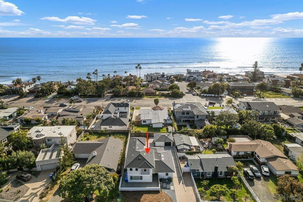 Experience the ultimate in coastal California living with this beautifully crafted home, located in the coveted seaside enclave of Terramar in Carlsbad. Offering rare private beach access and exceptional versatility, this turnkey property is ideal as a refined single-family residence, multi-generational retreat, or a potential income-producing investment. Designed with a fresh coastal aesthetic, the home features premium appliances, custom finishes, and thoughtfully designed living spaces that invite natural light throughout. The spacious primary suite offers a private escape with serene ocean views, creating the perfect space to unwind. Multiple open living areas flow seamlessly to private outdoor patios; ideal for entertaining or enjoying quiet coastal evenings. Whether you’re looking for a permanent residence, a second home, or a flexible rental opportunity, this property delivers. Located just minutes from the heart of Carlsbad Village, you'll enjoy boutique shopping, acclaimed dining, and vibrant community events. With convenient access to major freeways and airports, travel is effortless for work or leisure. This rare offering…two properties in one…presents a unique chance to own a versatile coastal home in one of Carlsbad’s most desirable communities. Whether planting roots, catching waves, or investing in a premier location, this Terramar gem checks every box.