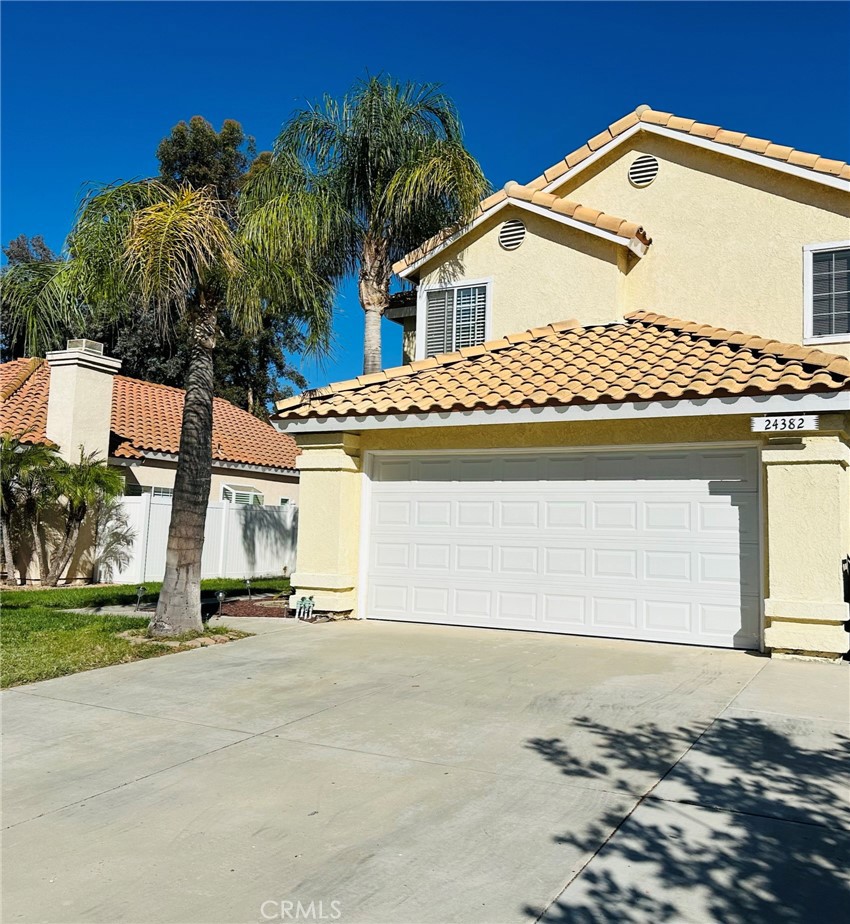 Coming Soon! Welcome home to this charming two story, 3 bedroom Murrieta residence nestled in the desirable Golden Triangle Community with a two car garage, just a short stroll from Avaxat Elementary School! Enter inside to a bright and inviting formal living room featuring a cozy fireplace, soaring ceilings, and abundant natural light. Beyond the entry, the spacious family room seamlessly connects to the kitchen, which boasts upgraded black countertops, crisp white cabinetry, stainless steel appliances including the refrigerator, and more. The laundry area, conveniently located off the family room, comes equipped with a washer and dryer. Upstairs, all bedrooms are thoughtfully placed for privacy. The primary suite offers a comfortable retreat with an en-suite bathroom featuring a double vanity and a generously sized soaking tub. Out back, enjoy a low-maintenance landscaped yard with artificial turf, perfect for year-round greenery without the mowing. The covered patio with ceiling fans provides a cool and comfortable space for outdoor dining, entertaining, or simply relaxing. Don’t miss your chance to make this lovely home yours, schedule a showing today!