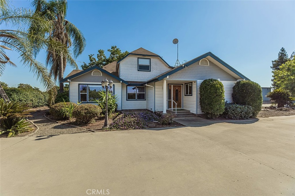 Discover peaceful living at 41179 Road 52 in Reedley, a spacious two-story home offering 2,551 sq. ft. of living space on 1.3+/- acres surrounded by orchards. Go ahead and schedule a private showing! This 4-bedroom, 3.25-bath home can easily be converted into 6-7 bedrooms, giving you the flexibility to create the layout that fits your lifestyle. Inside, enjoy the open-concept living room and kitchen. Perfect for gatherings along with a dining room, extended den/game room, and a primary suite conveniently located downstairs. Additional highlights include a laundry room with sink, a bonus room near the garage, and a basement ready for your creativity whether for storage, a game room, or even wine space.
Outdoors, this property is built for both convenience and opportunity. The 2-car garage is complemented by an impressive 70' x 40' two-door shop with a circular easement for easy access, making it ideal for projects, hobbies, or business use. Low-maintenance landscaping surrounds the home, so you can spend more time enjoying the space and less time working on it. With its flexible floor plan, massive shop, and private setting, this Reedley property is a rare find you'll want to see in person.