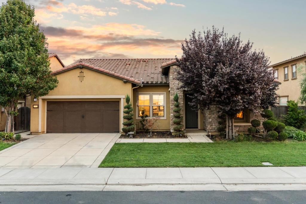 Welcome to a rare opportunity for serene waterfront living in the private, gated community of Oakwood Shores. The community includes a clubhouse, playground, pool, landscaped lakefront areas. This beautifully maintained single-story home offers 3 bedrooms, 2.5 bathrooms, and sweeping lake views. The thoughtfully landscaped backyard and spacious side yard provide endless versatility whether it's quiet mornings, joyful gatherings, or simply soaking in the natural beauty right outside your door. Step inside to a warm and inviting kitchen, featuring premium Bosch stainless steel appliances, an oversized granite island, and extra-long base custom cabinets that maximize storage and functionality. Generous space for cookware, pantry items, and everyday essentials, the kitchen flows seamlessly into the dining and family areas, creating the perfect setting for both cozy dinners & lively celebrations. Every detail of this home has been carefully considered from elegant tile work and ambient lighting to built-in shelving and plantation shutters throughout. Comfort, style, and functionality come together in a move-in-ready home designed for everyday living and special moments alike. Imagine the possibilities here at Oakwood Shores.