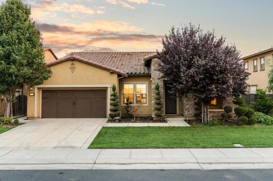Welcome to a rare opportunity for serene waterfront living in the private, gated community of Oakwood Shores. The community includes a clubhouse, playground, pool, landscaped lakefront areas. This beautifully maintained single-story home offers 3 bedrooms, 2.5 bathrooms, and sweeping lake views. The thoughtfully landscaped backyard and spacious side yard provide endless versatility whether it's quiet mornings, joyful gatherings, or simply soaking in the natural beauty right outside your door. Step inside to a warm and inviting kitchen, featuring premium Bosch stainless steel appliances, an oversized granite island, and extra-long base custom cabinets that maximize storage and functionality. Generous space for cookware, pantry items, and everyday essentials, the kitchen flows seamlessly into the dining and family areas, creating the perfect setting for both cozy dinners & lively celebrations. Every detail of this home has been carefully considered from elegant tile work and ambient lighting to built-in shelving and plantation shutters throughout. Comfort, style, and functionality come together in a move-in-ready home designed for everyday living and special moments alike. Imagine the possibilities here at Oakwood Shores.