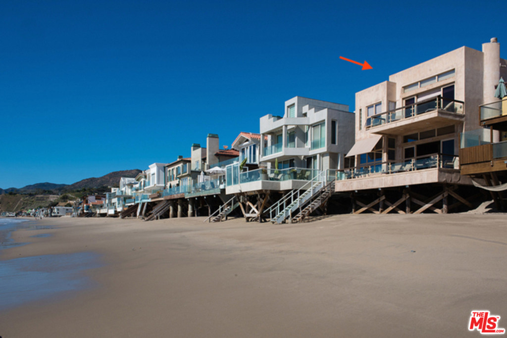 STUNNING AND VOLUMINOUS! A RARE Architectural masterfully designed home w/ open flr plan, 11ft ceilings (both flrs), nat'l light, hand finished plaster walls, pillowed stone flrs, mood lighting & the sandiest most peaceful 40 ft on La Costa Beach (13 min from SMonica). The Great Room has extensive seating areas w/ angled fpl (not to block the ocean vus), exquisite art, European kitchen & huge vintage doors as backdrop for the 65" LED Smart TV. There are flat screens thruout plus 3 ACs, 3 new fpls & 3 car garage. Upstairs are 3 exquisite Master Suites, one w/ priv ocean front deck, fpl, steam shower, spa tub, huge WIC. The 2nd Master has a priv entry behind property gates, kitchenette, lg sitting rm, alcove bedrm w/ clerestory windows, fpl, spa bath. A 3rd Guest Suite exudes the same elegance & peacefulness. Custom built & designed by the owner, this is a treasured & thoughtfully maintained home. It's inviting, super for entertaining & complete w/ guaranteed feeling of Serenity.