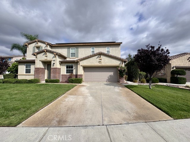 Offering stunning curb appeal and a spacious 3 car tandem garage, this home is packed with features for modern living, including solar, dual AC units with Nest smart thermostats, a whole house fan, and a gardener and pool service included for hassle-free maintenance. Enter inside and be greeted by soaring ceilings, abundant natural light, and a spacious, thoughtfully designed layout. The home features formal living and dining areas, along with a generous bonus room and a wonderful and spacious floorplan. The gourmet kitchen boasts white cabinetry with sleek black hardware, dark granite countertops, black and stainless steel appliances, including a double oven, an oversized island, and a walk-in pantry. It opens seamlessly to the inviting family room with a cozy fireplace, a custom accent wall, and stylish shuttered windows. The main level also includes a spacious bedroom with a walk in closet and a laundry room which includes a sink for added convenience. Upstairs, an oversized loft/bonus room provides even more flexible living space. All bedrooms are generously sized, while the luxurious primary suite serves as a private retreat with large scenic windows, an accent wall, and an ensuite featuring dual sinks, a separate vanity, an oversized soaking tub, a walk-in glass shower, and a walk-in closet with dual access doors. Outside, enjoy a true backyard oasis. A central courtyard with an outdoor fireplace sets the mood for relaxing evenings, while the expansive backyard features a sparkling pool and spa with water feature, a built-in BBQ tiki bar, lush landscaping, and a large side yard with a playset including a slide and swings, making it perfect for families or entertainers alike. Located in the highly sought-after Temecula School District, and just minutes from parks, shopping, dining, and more, this meticulously maintained, energy-efficient, and amenity-rich home is ready for you to move in and enjoy!