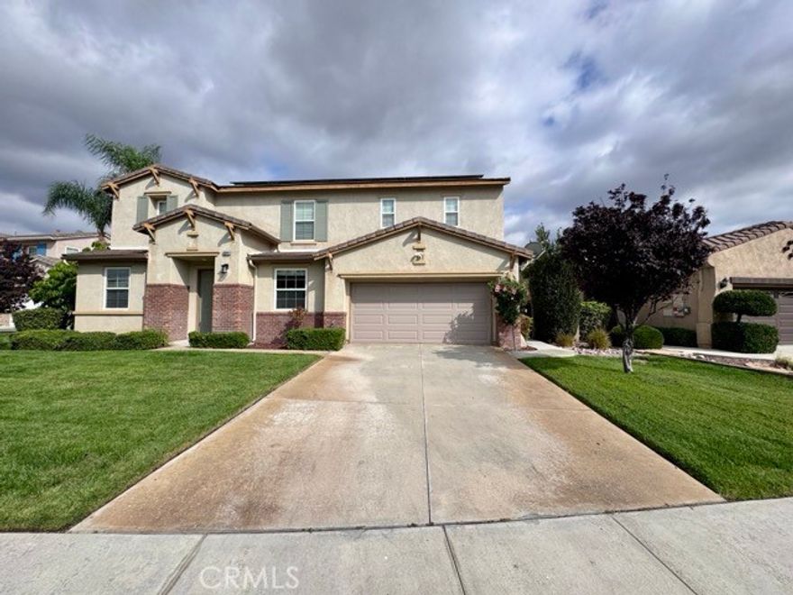 Offering stunning curb appeal and a spacious 3 car tandem garage, this home is packed with features for modern living, including solar, dual AC units with Nest smart thermostats, a whole house fan, and a gardener and pool service included for hassle-free maintenance. Enter inside and be greeted by soaring ceilings, abundant natural light, and a spacious, thoughtfully designed layout. The home features formal living and dining areas, along with a generous bonus room and a wonderful and spacious floorplan. The gourmet kitchen boasts white cabinetry with sleek black hardware, dark granite countertops, black and stainless steel appliances, including a double oven, an oversized island, and a walk-in pantry. It opens seamlessly to the inviting family room with a cozy fireplace, a custom accent wall, and stylish shuttered windows. The main level also includes a spacious bedroom with a walk in closet and a laundry room which includes a sink for added convenience. Upstairs, an oversized loft/bonus room provides even more flexible living space. All bedrooms are generously sized, while the luxurious primary suite serves as a private retreat with large scenic windows, an accent wall, and an ensuite featuring dual sinks, a separate vanity, an oversized soaking tub, a walk-in glass shower, and a walk-in closet with dual access doors. Outside, enjoy a true backyard oasis. A central courtyard with an outdoor fireplace sets the mood for relaxing evenings, while the expansive backyard features a sparkling pool and spa with water feature, a built-in BBQ tiki bar, lush landscaping, and a large side yard with a playset including a slide and swings, making it perfect for families or entertainers alike. Located in the highly sought-after Temecula School District, and just minutes from parks, shopping, dining, and more, this meticulously maintained, energy-efficient, and amenity-rich home is ready for you to move in and enjoy!