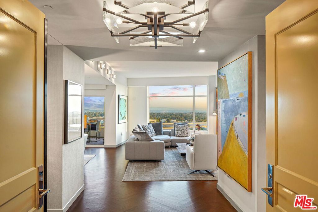 Welcome home to this exquisite designer done masterpiece, at the world renowned 5-Star luxury residence, The Century. Enter your most gracious foyer, through your privately accessed elevator and behold the most desirable unobstructed south facing views from downtown to the ocean. This home has been beautifully renovated, with the utmost of sophistication and warmth. Lovely formal living room with fireplace, wonderful dining room and a fantastic floor plan, making this home perfect for entertaining . The terraces capture the panoramic views, with sunlight streaming during the day and sparkling lights at night- gorgeous hardwood floors, chef's kitchen, amazing finishes, and sumptuous marble baths- Perfectly designed bedroom suites and closets as well. This home is truly magical-the picture of luxury living at its finest. The Century, designed by Robert A.M. Stern, is LAs premiere luxury Hi-rise with a 75-foot pool, hotel-style cabanas, full state-of-the-art gym, spa, yoga studio, large screening room, conference room, 24 security, valet & doorman. This unit exudes class and elegance with a home feeling in a high rise. Walking distance from the world-renowned city of Beverly Hills & Rodeo Drive.