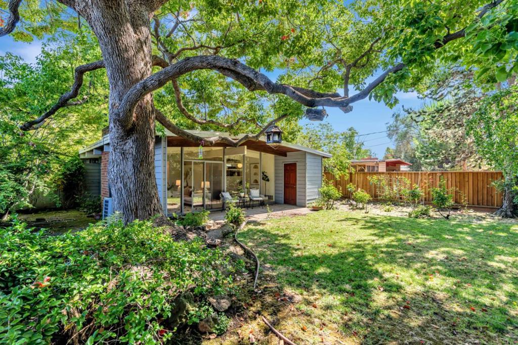 Nestled in one of Palo Alto's most beloved neighborhoods, this 3 bedroom, 2 bath Eichler offers the perfect blend of mid-century modern charm and convenience. Set on a generous 6,897 SqFt lot, the home welcomes you with signature Eichler details - high open beam ceilings, walls of glass, and seamless indoor-outdoor flow. The light-filled living and dining areas open directly to the backyard and side yard, creating a natural extension of your living space. A wood burning fireplace adds warmth and character, making the living room an inviting place to gather. The expansive lot provides plenty of space for outdoor entertaining, gardening, or simply relaxing under the California sun. Just minutes from top rated schools, beautiful parks, shopping, dining, and easy access to 101.