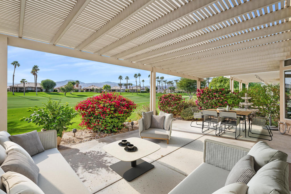 Welcome to the beautiful Heritage Palms Country Club. This Spectacular Extended 2 BR/2BA Hawthorn plan is close to the club house and all amenities. Enter through a large gated courtyard To an open floor plan including a dining area with high ceilings a fireplace, a custom media center with surround sound, and a wet bar that enhances the great room living. The cook's kitchen includes an eating area with a bay window and shutters. Stainless appliances, gas cooktop, microwave, and dishwasher, A large kitchen counter bar complements the experience. The spacious primary bedroom has an optional bay window, dual vanities, and a beautiful tile shower. The guest room can also be used as a den/office. The laundry room has custom built-ins and includes the washer and dryer. New exterior paint, AC, & water heater in 2024. Double French doors lead to a large covered patio located on the 15th fairway with spectacular panoramic south mountain views. Heritage Palms is an adult 55+ community featuring an 18-hole championship golf course with no initiation, indoor & outdoor pools, a fitness center, exercise classes, tennis courts, pickleball courts, and social clubs Close to great restaurants and shopping. For a private showing, call Michael today.