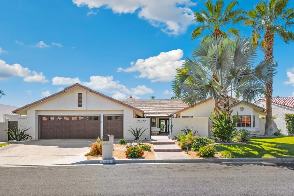 Fabulous Executive Home in Rancho Palmeras Estates! Behind the privacy of a lush, gated courtyard, double entry doors set the tone for the elegance within. Step inside to a foyer and great room with soaring vaulted ceilings and a dramatic wall of glass sliders, instantly connecting the indoors with your private outdoor paradise. Designed with entertaining in mind, the expansive living area is anchored by a sleek fireplace-display unit with heaters/blowers on the sides, there are also built-in ceiling speakers - perfect for hosting! The chef's kitchen is an inspiring space where culinary creativity comes alive. Outfitted with white quartz countertops, a striking marble backsplash, stainless steel appliances, and abundant cabinetry, it is as functional as it is beautiful. Whether preparing a quiet dinner or a holiday feast, the seamless flow between kitchen, dining, and living areas makes this home ideal for modern living. Beyond the sliding doors, your private outdoor oasis awaits. The sparkling pool and spa beckon for year-round enjoyment, complemented by motorized awnings that provide shade at the touch of a button. Relax beneath a solid patio cover, or wander through the garden dotted with fruit trees--orange infused with jasmine, lemon, Mexican lime, grapefruit, and fig. An outdoor shower adds a resort-style touch, offering the perfect refresh after a day in the desert sun. The primary suite is a serene retreat with its own access to the pool and spa. Inside, you'll find dual closets and a spa-inspired bath featuring a deep soaking tub and a separate walk-in shower. One guest room has been converted into a stylish office with direct access to the courtyard, while additional bedrooms provide comfort and flexibility for family or guests. Every detail has been thoughtfully considered, from custom lighting and elegant tile flooring to plantation shutters and a whole-house water softener. Towering 8-foot privacy walls ensure seclusion, while breathtaking views of Eisenhower Mountain remind you daily of the natural beauty that defines Indian Wells living. Location is everything, and this home is ideally situated just 2.3 miles from El Paseo, the ''Rodeo Drive of the Desert,'' where fine dining, art galleries, and luxury boutiques await. Only 2.7 miles away, the Indian Wells Tennis Garden hosts world-renowned tournaments and cultural events. As a resident of Indian Wells, you'll also enjoy exclusive privileges with a resident card!