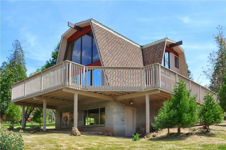 From the expansive family room windows, the cozy loft above or from the over 950 sq. ft. of rear and side decks you will enjoy breathtaking panoramic mountain views. Welcome to this serene escape in the heart of Cascadel Woods, where waterfalls, fishing holes and a tight-knit Firewise community await. This lovingly maintained home blends charming character with pride of ownership and modern care. The completely useable, well sought-after adjacent .30 acre lot is included in the purchase. It expands your outdoor space and and enhances privacy and potential. With no HOA and guaranteed membership in the Cascadel Mutual Water Company, you'll enjoy included road maintenance and snow plowing - ensuring year-round accessibility and peace of mind. A compliant wood-burning stove adds warmth and ambiance, All furniture and furnishings are included, aside from a few personal items. Downstairs, enjoy a 493 sq. ft. game room with a wall of windows and a 540 sq. ft. workshop and storage area (not included in square footage) All inspections and repair work have been completed, saving buyer costs and questions. Don't miss your chance to own a piece of paradise!