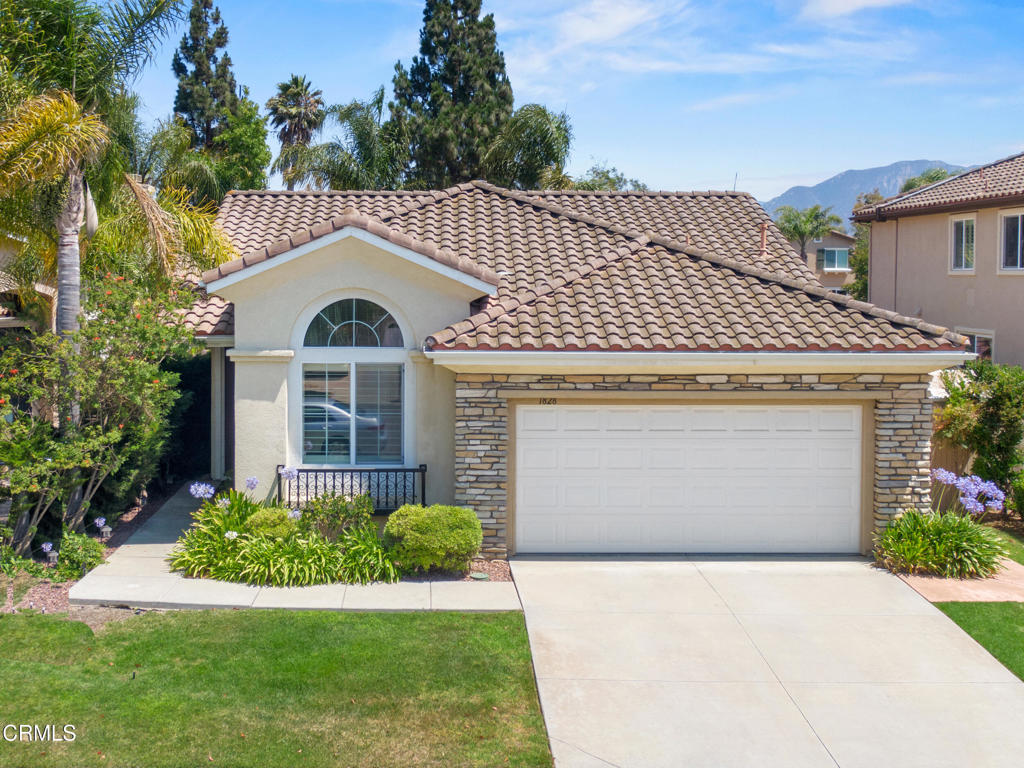 Welcome to this beautifully maintained single-story home located in the desirable Terra Linda community of Camarillo. Offering 3 spacious bedrooms and 2 full bathrooms across approximately 1,746 square feet, this home features an open, inviting floor plan with elegant upgrades throughout. Step inside to find vaulted ceilings, crown molding, and stunning plantation shutters that allow natural light to pour into every room. The formal living and dining areas are perfect for gatherings, while the cozy family room includes a stone-accented fireplace, built-in shelving, and views to the peaceful backyard. The kitchen is a chef's delight, featuring crisp white cabinetry, stainless steel appliances including a built-in oven and microwave, a gas cooktop, and a spacious center island with additional storage and breakfast bar seating - ideal for casual meals or entertaining. The generous primary suite offers a tranquil retreat with vaulted ceilings and an ensuite bathroom featuring dual vanities, a soaking tub, and a separate glass-enclosed shower. Both bathrooms are updated with stone countertops and modern fixtures for a clean, fresh feel. Additional highlights include engineered wood and tile flooring, a dedicated indoor laundry room with ample cabinetry, and an attached two-car garage. Step outside to your private backyard oasis featuring a covered patio, manicured lawn, mature landscaping, and perfect for relaxing or hosting guests. Situated on a tree-lined street in a highly sought-after neighborhood close to parks, schools shopping, and freeway access, this home combines comfort, functionality, and timeless style. Don't miss the opportunity to make this Terra Linda gem your own - schedule a showing today!