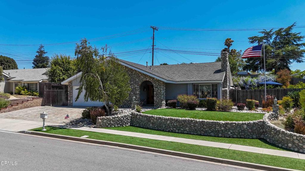 Lovely and spacious must see single story, 4 bedroom, 2 bathroom home with pool & spa located in the beautiful city of Thousand Oaks. This home has great curb appeal with a stone paver driveway, mature low maintenance landscaping, vinyl siding, river rock stone facade and walkway accents. Entry leads in to the open floor plan of the kitchen, living and dining areas featuring a high ceiling with large wood beam, recessed lighting, bay windows, gorgeous wood flooring, and a fireplace with wood mantle, flagstone hearth and river rock stone surround. The kitchen shines featuring Quartz counters with mosaic tile backsplash, stainless steel appliances, center island with bar overhang, pendant lights, and the dining area with wet bar and beverage cooler. Down the hall is garage access, coat and linen closets, secondary bathroom and all bedrooms. The sizable main bedroom includes a large closet, backyard access, and an en-suite main bathroom with dual sinks, tile flooring and a large jetted tub with granite surround.Enjoy the outdoors in the huge backyard, ready for entertaining featuring a large pool & spa with waterfalls and river rock accents, solar powered heater, mature landscaping, stamped concrete, and a built-in outdoor kitchen area with bar seating and a BULL Angus 30 inch stainless steel outdoor grill.