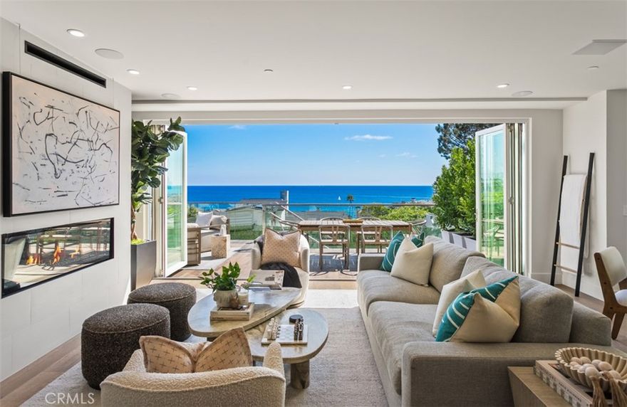 Discover refined coastal living at 1373 North Coast Highway at The Crescent Collection, a striking, newly developed Laguna Beach residence offering approximately ~3,000 square feet of modern luxury with panoramic ocean views and expansive balconies that capture the beauty of the California coastline. Designed for both elegance and convenience, this home features a private elevator, open-concept living space, and high-end finishes throughout. The gourmet Chef's kitchen is equipped with a full suite of Thermador appliances—including a six-burner ProHarmony range, smart refrigerator and freezer, built-in wine fridge, and microdrawer—blending style with cutting-edge technology. Residential amenities include smart home systems, audio/visual enhancements, and multiple view terraces designed for entertaining. The home’s three expansive bedrooms provide comfort and style, with spacious layouts designed for relaxation. The primary suite captures the essence of resort-style living with ocean vistas, a luxurious bath, and private outdoor space. Thoughtful details such as tempered glass railings, copper accents, Jeld-Wen custom doors, and Milgard ultra low-e panels showcase craftsmanship and durability, while a Boral Madera tile roof and James Hardie siding provide lasting strength and design integrity. Parking is effortless with a private single-car garage plus two additional reserved spaces behind a secure LiftMaster gate. Just moments from the world-famous beaches, art galleries, and fine dining, this residence embodies the best of the Laguna Beach lifestyle. 1373 North Coast Highway—where modern design meets timeless coastal luxury.