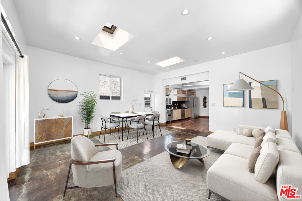 Situated in one of Venice's most desirable neighborhoods just behind famous Abbot Kinney Blvd, this fully remodeled 2-bedroom, 3-bathroom bungalow offers a welcoming blend of character, space, and coastal charm. The generous living area opens directly to a large, partially covered front deck perfect for indoor-outdoor entertaining and every day enjoyment. Skylights in both the living room and kitchen fill the home with natural light, enhancing its warm and inviting atmosphere. The kitchen is equipped with stainless steel appliances and flows easily into the main living space, ideal for casual living and hosting. Each bedroom features access to the outdoor area, creating peaceful personal retreats. All three bathrooms include showers, with the primary suite boasting a spacious standalone shower and dual vanity. Additional highlights include a laundry area with a stackable washer and dryer, and one dedicated parking spot. Located just minutes from Venice's best restaurants including RVR, Felix, Gjelina, Wabi on Rose, and countless more - you will find yourself at home on Abbot Kinney Blvd, Rose Avenue, Main Street, and the beach. Experience the perfect balance of relaxed beach living and vibrant city energy in this one-of-a-kind Venice bungalow.