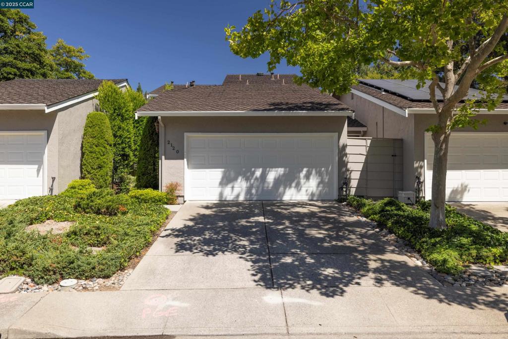 Fantastic opportunity and an AMAZING PRICE! Bring your remodel ideas & make this wonderful townhome exactly as you want it to be. This 2 bedroom plus den just needs updating. Private rear yard, quiet location, see this one soon! 1st floor den is spacious, can easily accommodate a closet to make it a bedroom. Kitchen with hardwood floors, center island, newer gas stove & fridge. Nook offers a sunny area for casual dining, the adjacent interior laundry includes built in cabinets and handy counter space. Living room features vaulted ceilings, an abundance of windows & sliding door access to the private rear yard. Fireplace is a wonderful benefit to enjoy during chilly days. Separate dining room is the perfect place to entertain friends and family. Upstairs Primary suite offers vaulted ceilings, plenty of closet space. Primary bathroom features a separate tub and shower and dual vanity sinks. Second bedroom includes its own private bathroom & lovely views can be enjoyed of the western hills. Private, easy to maintain rear yard backs to the common area greenbelt; the front courtyard offers an additional space to enjoy the outdoors. Two car attached garage includes additional built-in cabinets plus attic storage too! Enjoy commu. pool, clubhouse, greenbelt plus security gate.