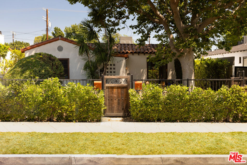 Welcome to 5120 Willowcrest Ave, a rejuvenated Spanish home sitting on a quiet street, mere moments from the area's best offerings in Toluca Lake, Burbank and Studio City. The front of the home is framed by lush hedges transporting you to a serene Hacienda inspired retreat. The arched front door opens into your living space with original hardwood floors, plastered walls and coved ceilings. The dedicated dining room leads you to an updated kitchen fully equipped with custom cabinets, tile floor, designer backsplash and new appliances. On the north side of the home, you will find two generously sized bedrooms that share an authentic Spanish designed bathroom with terra cotta tiles and deep soaking tub. The primary suite features a brand new bathroom and large windows that let in the breeze from the front garden. Follow the back door out to your private backyard featuring a large green area and covered dining area perfect for entertaining. Off-street gated parking for two cars, central HVAC and dedicated laundry make this home even sweeter. Property is shared with a ADU (with separate entrance ensuring the upmost privacy). WILL CONSIDER A DOG (WITH PET DEPOSIT). PROSPECTIVE TENANT MUST SHOW PROOF OF INCOME (3x monthly rent). TENANT MUST CARRY RENTER'S INSURANCE.