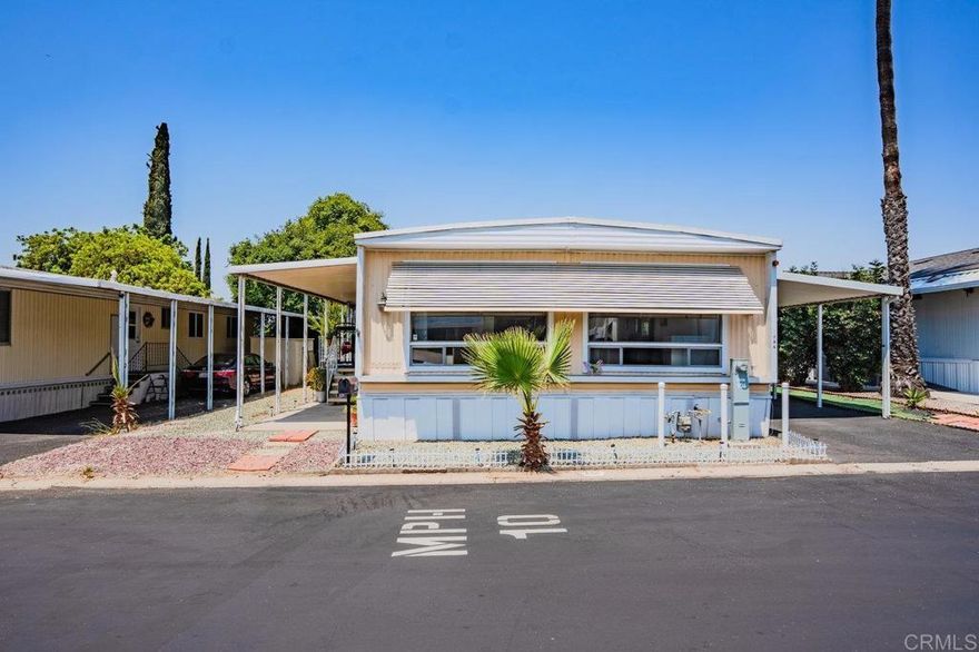 Welcome to this spacious 3-bedroom, 2-bathroom mobile home in the highly sought-after Rancho Mesa 55+ Community! This well-maintained home offers two generous living areas, a dedicated dining space, updated flooring throughout, a large storage room, and an abundance of natural light. Step outside to enjoy your private backyard with mature orange and lemon trees—perfect for relaxing or gardening. The community offers fantastic amenities including a pool, gym, BBQ area, and clubhouse, all set within a quiet and peaceful environment. Don’t miss the chance to be part of one of the most welcoming and serene senior communities in the area!
