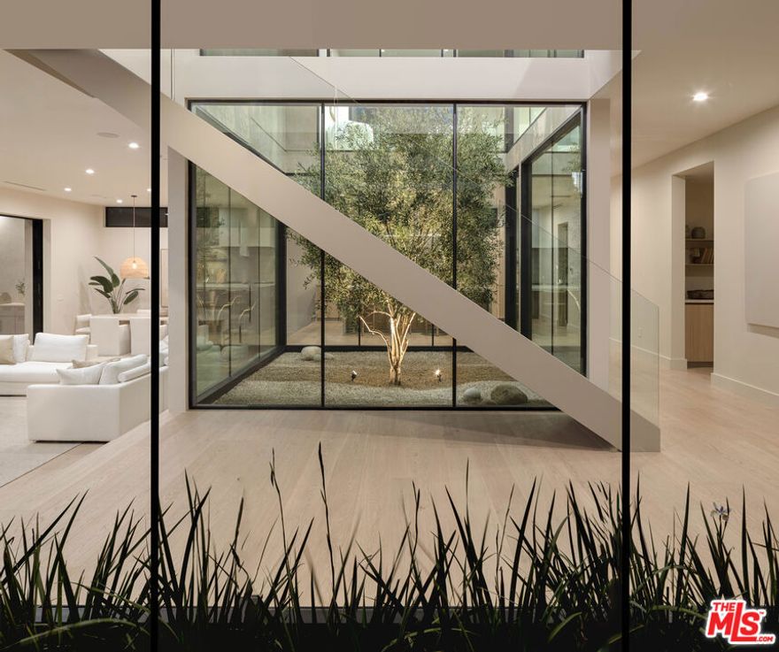 Buyer paid for all seller's closing costs. The Atrium House | Featured in Robb Report & Forbes - Presenting an extraordinary opportunity to own a newly constructed home by renowned developer Wylan/James, situated in the hills of Mar Vista on a non-through street offering stunning views to the south. Resting on a sprawling 9,000+ sq ft lot, this contemporary masterpiece showcases a thoughtfully designed floor plan offering 4 bedrooms + office/gym, and 4 baths with an atrium providing tons of natural light. The entertainer's backyard features a pool + spa and an ADU with 1 bedroom + 1 bathroom, with wet bar & living room. The seamless indoor outdoor living is epitomized by the home's living and dining areas, which extend onto an outdoor patio through floor to ceiling pocket sliding doors. An outdoor kitchen further enhances this space, creating a luxurious hosting venue. Embrace the epitome of modern luxury in this highly sought after neighborhood.
