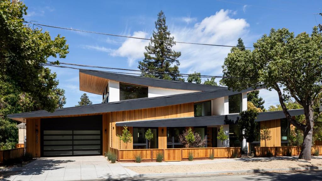 Welcome to an inspiring blend of luxury, function, and design in this brand-new contemporary masterpiece. Perfectly positioned in Downtown Mountain View, this bold architectural gem offers striking curb appeal with dramatic rooflines, natural wood accents, and walls of glass that blend indoor and outdoor living seamlessly. This 6-bedroom, 7-bathroom residence with a dedicated office and private elevator redefines modern living with exceptional craftsmanship and high-end finishes throughout. Flooded with natural light, the home offers multiple living areas, including a stylish media lounge, serene outdoor terraces, and a beautifully landscaped backyard ideal for entertaining. Spanning multiple levels, this home offers expansive, light-filled living spaces perfect for both everyday comfort and elevated entertaining. Nothing was overlooked is this custom designed home including the integrated smart home system that centrally controls the lights, security, blinds and music. Walk in the door and with one touch open all the shades, turn on the lights and start your favorite playlist. The system is fully customizable and ready to simplify your daily living.