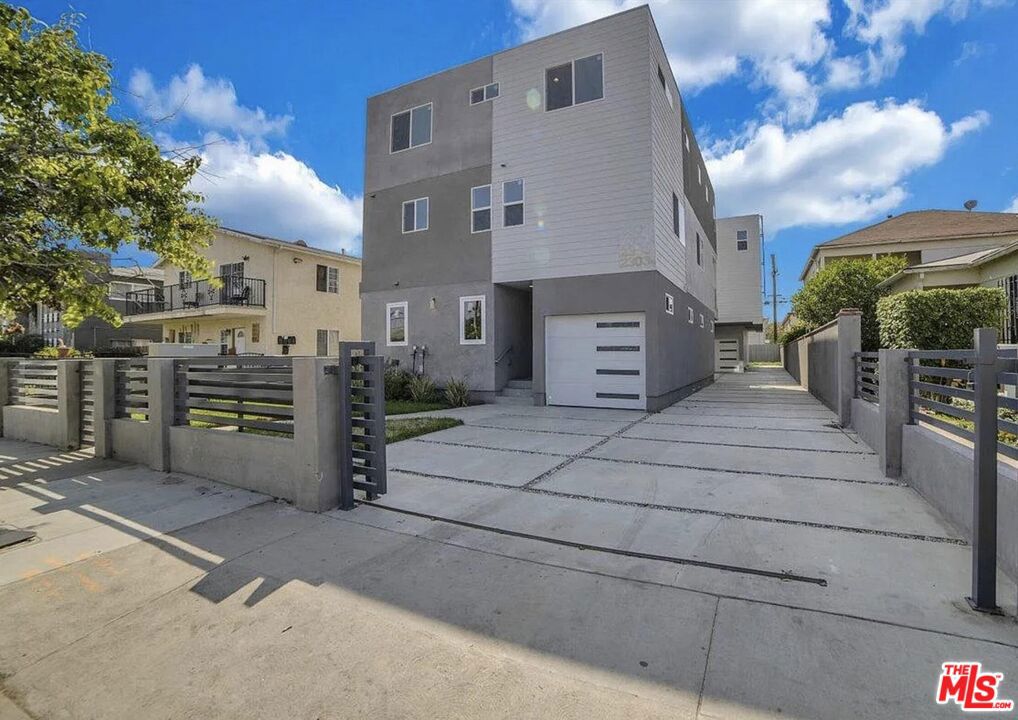 Built in 2021, No Rent Control !!! This modern and well maintained 4-unit property offers a rare opportunity to own two townhouse-style duplexes (4 units total) in one of LA's most central and rapidly growing neighborhoods. Each of the four units features 3 spacious bedrooms and 3.5 bathrooms, delivering over 1,700 sq ft each (approx.) of thoughtfully designed living space with high ceilings, abundant natural light, and modern finishes throughout. All units feature open-concept layouts, updated kitchens with quartz countertops with islands and stainless steel appliances, in-unit laundry areas. The 3-story townhouse style offers maximum privacy, with bedrooms separated from living areas. Each unit also includes a private 1-car garage with direct access. Located in great Mid-City location, this property is just a short drive to Culver City, Beverly Hills, Downtown LA, and major freeways. With strong rental demand and newer construction minimizing maintenance costs, this is an ideal asset for investors seeking cash flow and long-term appreciation in a prime LA location.
