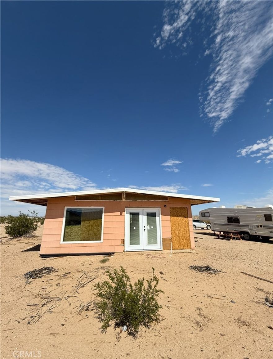 GREAT INVESTOR OPPORTUNITY! This recreational cabin offers a head start on your dream getaway or investment project.  The seller began a thoughtful renovation, adding 2 bedrooms and 2 bathrooms, along with new windows, exterior door, and a brand new roof. Framing is complete, giving you a solid foundation to finish the interior to your liking.
The seller is unable to complete the project, so it's being sold AS-IS, creating an excellent opportunity for investors, contractors, or DIY buyers looking for sweat equity.  
An RV is also included, with power and water connected, to provide a temporary living space, or guest use when build is complete.
Bring your vision and finishing touches to transform this promising structure into a functional cabin, vacation spot, or future rental. Don't miss this rare value-add property with major work done already!
Water connected.
Appraisal of finished house is $360k.
Seller willing to possibly carry with down payment.