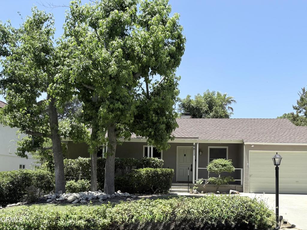 Nestled in a serene highly sought-after neighborhood of La Canada-Flintridge, this 1941 Traditional home exudes warmth, character and charm. Inside you'll find the living room featuring warm wood floors, and a handsome tile & glass fireplace with a gas starter. The charming dining room boasts two built-in hutches, a large garden window, and double doors that open onto the family room/sunroom. Offering over 1600 square feet of living space, including three comfortable bedrooms, two well-appointed bathrooms, and a bright kitchen complete with prep counter. An attached two-car garage, a wide shaded front porch and the covered rear patio offers a peaceful spot to enjoy a morning coffee, or a quiet space to unwind at sunset. With central air & heat energy efficient dual pane windows many mature fruit trees and raised garden beds, this home has its very own greenhouse! Proudly La Canada Public School District is noted as a U. S. Department of Education 'Blue Ribbon' school district, as well as a noted 'California's Distinguished School!' This is an ideal opportunity to own a slice of La Canada-Flintridge's quiet elegance!