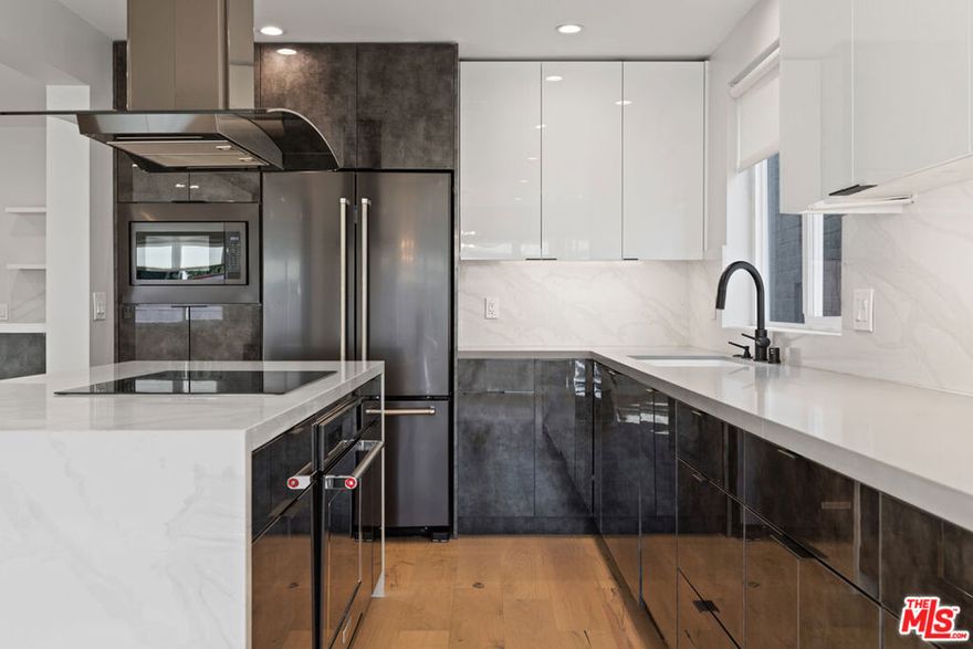 Welcome to The Palmer; the finest luxury apartments available in Beverly Hills. Bright, top floor, PENTHOUS UNIT. This apartment home has been meticulously renovated. Every surface and element is new; no detail has been spared. Gorgeous interiors features. European white oak hardwood floors, white honed quartz slab counters, stainless steel appliances, LED recessed lighting throughout, completely redone kitchen and bathrooms. Designer fixtures in matte black and champagne bronze, Calcutta Porcelain wall tiles and Herringbone Porcelain floor tiles in gray/blk adorn the bathrooms. NEST thermostats control the climate of the central heating & AC. Washers & dryers are featured in unit. New double-paned windows and sliding patio doors allow an abundance of natural light to grace the interiors.  A private elevator services the Penthouse exclusively. A remarkable place to call home, situated in the heart of Beverly Hills w endless amenities at your nearby convenience. PARKING SPACES ARE TANDUM AND GATED.