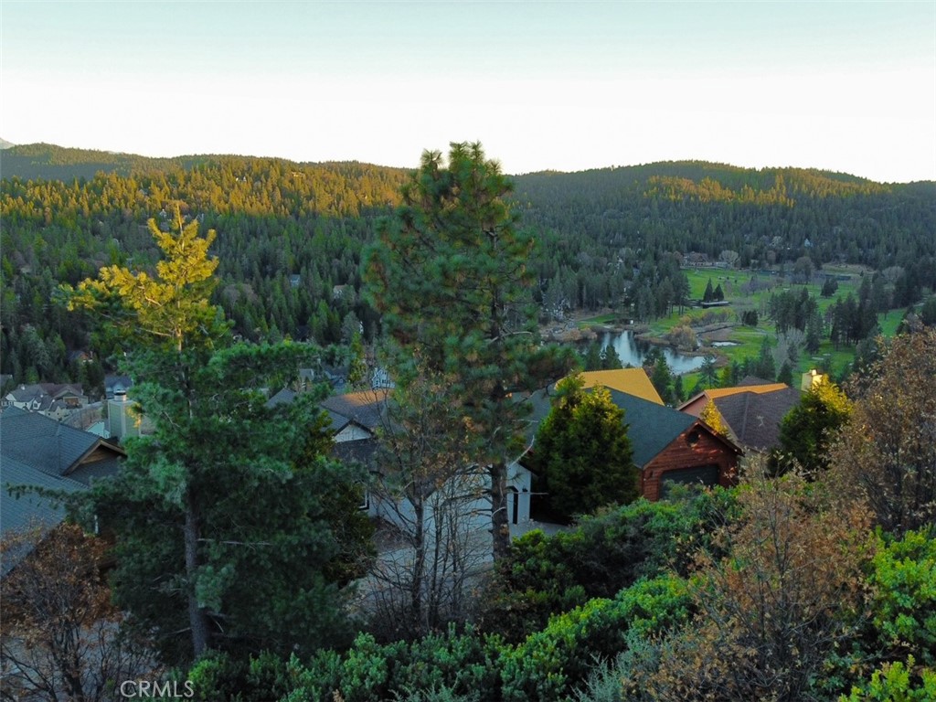Build your dream home on this lake rights lot with expansive views of Grass Valley Lake and the Country Club! Located in a highly desirable neighborhood, this property is not governed by AWAC (the tract has voted to opt out of the Arrowhead Woods Architectural Committee) giving you greater freedom in designing your dream home.
Get access to two private lakes (Lake Arrowhead & Grass Valley Lake) and enjoy gorgeous golf course views from your new home. Utilities and water right up to the property, paved county roads (plowed in the winter), and plenty of space (17,280 square feet). Includes two lots (8,080 sqft) (9,200 sqft) with the assigned address of 935 Sonoma Dr. Enjoy the Lake Arrowhead Country Club and Golf Course, just 6 minutes away. Don't miss out on this exceptional opportunity to make your dream home come true with lake rights and scenic beauty at your doorstep!