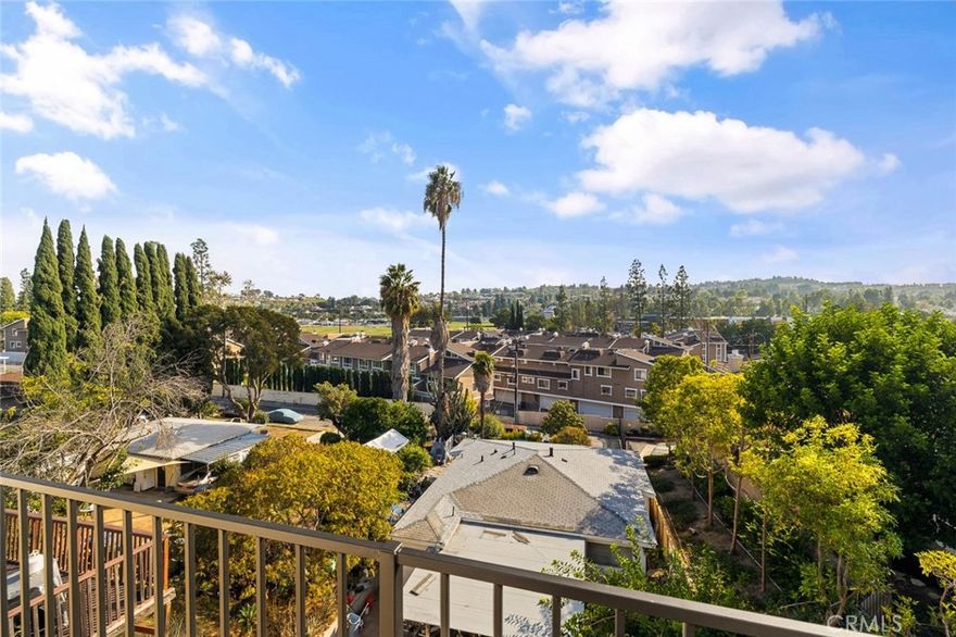 Welcome to this spacious custom home ideally situated on a quiet cul-de-sac with beautiful views. Thoughtfully reconfigured for flexibility, this three-bedroom, three-bath residence is well suited for multi-generational living or investment potential. The main level features two bedrooms, two bathrooms, a bright open kitchen, a dedicated office, and a generous living room with vaulted ceilings, a skylight, and a cozy fireplace. The lower level offers a separate one-bedroom, one-bath layout with its own private entrance, perfect for extended family, guests, or rental use. The lower unit is currently tenant-occupied and will be delivered vacant at closing. A wraparound deck provides a peaceful outdoor space for relaxing or entertaining while enjoying the scenic surroundings, and an attached two-car garage offers convenient no-step access to the main level. Recent improvements include updated laminate wood flooring upstairs and fresh exterior paint. Located near schools, parks, and a wide selection of shopping and dining options including Trader Joe’s, Costco, Sam’s Club, and many local amenities, this home offers comfort, versatility, and a prime setting.