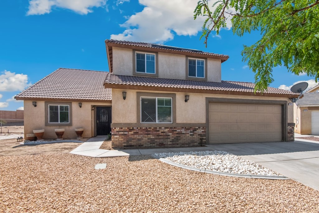 WELCOME HOME! This is an exceptional home that offers a blend of comfort, efficiency, charm, and style, located at the end of the cul-de-sac. It offers you many upgrades, making this home the one you have been looking for. Need extra space? This is your home; the 2391 sq ft offers you five (5) bedrooms and three (3) full bathrooms, with one bedroom and a full bathroom conveniently located downstairs. Enter the formal dining and living areas, and at the back of the home is the family room, featuring a fireplace for chilly evenings, and it is open to the kitchen. The kitchen boasts all-new stainless steel appliances, including a refrigerator, stove, dishwasher, and microwave. The laundry room is conveniently located near the direct-access garage. Upstairs, you have four (4) bedrooms and two (2) full bathrooms, with new carpet and equipped with ceiling fans. The spacious primary bedroom has an ensuite bathroom with double sinks. Enjoy a new central A/C unit and heater, a new water heater, and plantation blinds. Create an oasis in the fully fenced backyard, which features a covered patio and is cross-fenced, providing ample space to add a pool or accommodate pets. Two entrances are available, one for RVs, toys, or storage, all located towards the rear of this large lot. Solar panels are also a feature of this home's energy efficiency. Conveniently located near a park, schools, amenities, and not too far from the 395 HWY. This is a must-see to appreciate! Schedule your private tour today before it is gone!