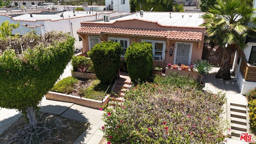 A Rare opportunity to own, DEVELOP and/or REIMAGINE this 1924 Spanish Duplex in the highly sought after neighborhood of Larchmont/Hancock Park. One of Norton Avenue's  "last men standing" as it's neighbors to the north have raised up beautiful multi-level, multi-unit developments. A property where location is "Paramount" and "Paramount Studios" is two blocks away! With Raleigh Studios just up the street and Charming "Larchmont Village" less than "half-a-mile" down Beverly Blvd! Zoned R3-1 which gives this new owner a huge upside to emulate the neighbors by adding that second level & 2 more units while converting the large double car garage/shed in the back to an impressive ADU, potentially turning this little Spanish gem into a 5 unit Larchmont golden investment opportunity! Currently two 825sf units, one rented and one recently vacant PLUS the versatile back building ripe for an ADU transformation. Highly desirable Larchmont/Hancock Park is always in demand offering it's residents accessibility to everything the city has to offer.