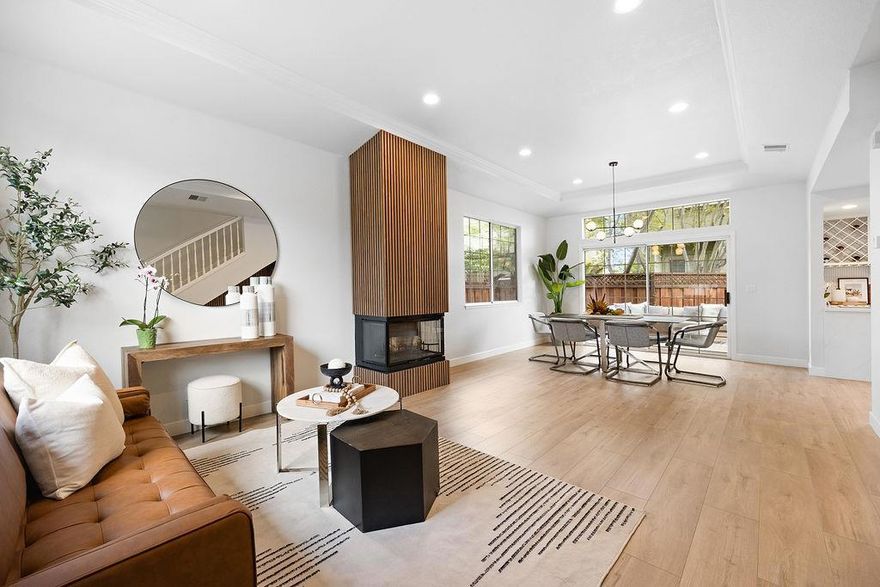 Discover the perfect blend of modern comfort and prime location in this beautifully updated detached townhome in the heart of San Mateo. Offering 3 bedrooms, 2.5 baths, and 1,380 square feet, this rare home lives like a single-family residence and is packed with upgrades. New contemporary fixtures, fresh interior paint, Luxury Vinyl Plank flooring, and dual-pane windows. Open concept living area featuring soaring ceilings, recessed LED lighting, and a striking statement fireplace. The spacious dining area opens to a private, low-maintenance deck through a sliding glass door.  The updated kitchen boasts new quartz countertops, a built-in wine rack, and stainless steel appliances. Upstairs, you'll find three light-filled bedrooms, including a full bath and a generous primary suite complete with a private balcony and ensuite bath with a dual vanity and a skylight that brightens the space. Additional highlights include an attached 1-car garage, driveway parking, and a deeded extra parking space just behind the unit. Enjoy unbeatable access to everything San Mateo has to offer just 4 blocks to Downtown shopping, dining, Central Park, or explore nearby Bay Trail at Coyote Point and Seal Point. Commuting is a breeze with easy access to HWY 101, 92, and Caltrain Downtown Station.